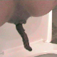 A girl squats over a toilet and takes a huge, long dump. About 2 minutes.